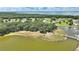 Scenic aerial view of the community with lakes, lush greenery, and various walking paths at 4709 Club Cir, Lakeshore, FL 33854