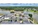 Scenic aerial view of community clubhouse with lake and boat docks at 4709 Club Cir, Lakeshore, FL 33854