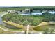 Community aerial view featuring walkways, lakes, and verdant landscaping at 4709 Club Cir, Lakeshore, FL 33854