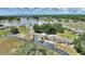 Aerial view capturing the community with the lake offering serene natural scenery and neighborhood feel at 4709 Club Cir, Lakeshore, FL 33854