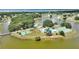 Stunning aerial view of the tennis and swimming pool area in community on the lake at 4709 Club Cir, Lakeshore, FL 33854
