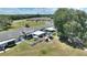 Aerial view showcasing the property's private patios, outdoor areas, and proximity to nearby amenities at 4709 Club Cir, Lakeshore, FL 33854