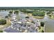 Aerial view of community clubhouse with lake, parking and boat docks at 4709 Club Cir, Lakeshore, FL 33854