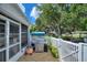 Patio with BBQ grill in a fenced backyard provides a private outdoor cooking and entertaining space at 4709 Club Cir, Lakeshore, FL 33854