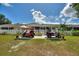 This home includes a fenced backyard and has room for a golf cart at 4709 Club Cir, Lakeshore, FL 33854