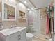 Bathroom featuring tiled walls, glass shower doors, and ample storage at 4709 Club Cir, Lakeshore, FL 33854