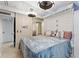 Well-lit bedroom with white brick accents and a neutral color scheme at 4709 Club Cir, Lakeshore, FL 33854
