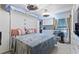 Bright bedroom with white brick accent wall, built-in storage and desk area at 4709 Club Cir, Lakeshore, FL 33854