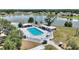 Aerial view of sparkling pool surrounded by sun loungers at 4709 Club Cir, Lakeshore, FL 33854