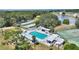 Aerial perspective of the community pool and recreation areas near the water at 4709 Club Cir, Lakeshore, FL 33854