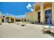 Beautiful courtyard with tables, umbrellas, and a fountain at 4709 Club Cir, Lakeshore, FL 33854