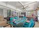 Sunroom with tile floors, hot tub, glass table and chairs and bright windows at 4709 Club Cir, Lakeshore, FL 33854