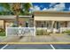 Charming home featuring a white picket fence, well-manicured landscaping, and a welcoming entrance at 4709 Club Cir, Lakeshore, FL 33854