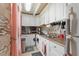 This home features a compact kitchen with lots of storage at 4709 Club Cir, Lakeshore, FL 33854