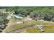 Overhead view of community amenities like shuffleboard, picnic area, and lake pier at 4709 Club Cir, Lakeshore, FL 33854