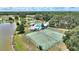 A bird's eye view of recreation area featuring shuffleboard, tennis, and lake access at 4709 Club Cir, Lakeshore, FL 33854