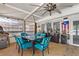 Bright sunroom features a ceiling fan, comfortable seating, and plenty of natural light at 4709 Club Cir, Lakeshore, FL 33854