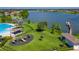 An aerial view of the community playground, lake, and amenities, perfect for Gathering fun and relaxation at 5660 Elsinore Way, Lakeland, FL 33805