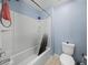 Bathroom featuring a shower/tub combo and a standard white toilet at 5660 Elsinore Way, Lakeland, FL 33805