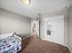 Bedroom with carpeted floors and double door closet at 5660 Elsinore Way, Lakeland, FL 33805