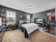 Bedroom with carpet, dark colored walls, and two windows at 5660 Elsinore Way, Lakeland, FL 33805