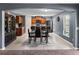 Stylish dining area featuring a modern table set and an open view of the kitchen at 5660 Elsinore Way, Lakeland, FL 33805