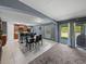 Bright dining space connects to a cozy living room and offers outdoor access through sliding doors at 5660 Elsinore Way, Lakeland, FL 33805