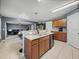 Spacious kitchen showcases granite countertops, tile flooring, and views into the living area at 5660 Elsinore Way, Lakeland, FL 33805