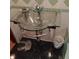 Unique glass vessel sink and black tile flooring featured in this bathroom at 6615 New Tampa Highway, Lakeland, FL 33815
