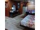 Cozy bedroom with wood paneling and a comfortable bed, perfect for relaxation at 6615 New Tampa Highway, Lakeland, FL 33815