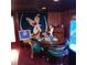 Eclectic dining room with acrylic chairs and parrot themed wall art at 6615 New Tampa Highway, Lakeland, FL 33815