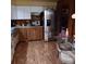 Traditional kitchen with stainless steel appliances, two-tone cabinets and wood-look flooring at 6615 New Tampa Highway, Lakeland, FL 33815
