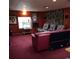 Spacious basement living room with wall mounted speakers and tropical mural at 6615 New Tampa Highway, Lakeland, FL 33815