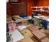 Cluttered room with tables, shelves, and acrylic chair at 6615 New Tampa Highway, Lakeland, FL 33815