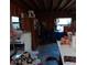 Interior storage with water heater, bins, and exposed wooden framing at 6615 New Tampa Highway, Lakeland, FL 33815