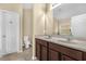 Bathroom with double sink vanity and tile flooring at 1111 Bassano Way, Orlando, FL 32828