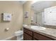 Bathroom featuring a sink, toilet, mirror, and shower offering a functional and stylish space at 1111 Bassano Way, Orlando, FL 32828