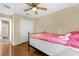 Bedroom featuring a ceiling fan, closet and neutral-colored walls, offering a cozy retreat at 1111 Bassano Way, Orlando, FL 32828