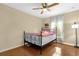 Bedroom with a ceiling fan, hardwood flooring and a window at 1111 Bassano Way, Orlando, FL 32828