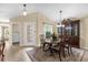 Bright dining room featuring decorative rug, ornate hutch and a door to the backyard at 1111 Bassano Way, Orlando, FL 32828