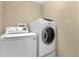 Convenient laundry room featuring modern washer and dryer appliances at 1111 Bassano Way, Orlando, FL 32828