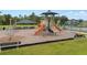 Community playground with colorful slides, climbing structures, and picnic area, providing a fun and safe environment at 1111 Bassano Way, Orlando, FL 32828