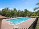 Enjoy the community pool with brick surround, tropical landscaping and lounge chairs at 1111 Bassano Way, Orlando, FL 32828
