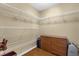 Spacious walk-in closet with wire shelving and a wooden dresser at 1111 Bassano Way, Orlando, FL 32828