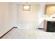 Bright dining area featuring tile flooring, a modern light fixture, and bright white walls at 8386 Sw 105Th Pl, Ocala, FL 34481