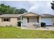 Charming single-story home features a well-maintained front yard and a welcoming covered entrance at 8386 Sw 105Th Pl, Ocala, FL 34481