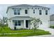 Charming two-story home with a manicured lawn and a two-car garage, inviting and well-maintained at 5543 Siltstone St, Lakeland, FL 33811