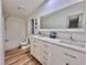 Updated bathroom features a double sink vanity with modern fixtures and a tub with shower at 5790 Cherry Tree Dr, Lakeland, FL 33811