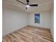 A secondary bedroom featuring wood-style flooring and a ceiling fan at 5790 Cherry Tree Dr, Lakeland, FL 33811