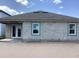 Concrete-block construction, this home features a rear patio and ample natural light with dual windows at 5722 Cattle Ranch Drive, St Cloud, FL 34771